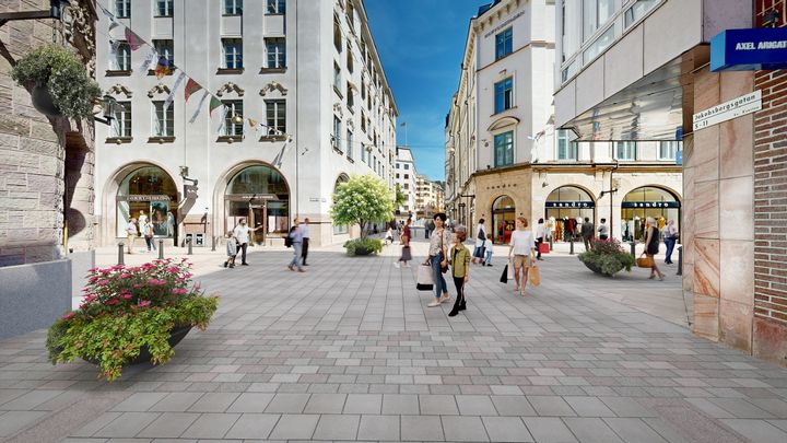 Korsning gågata med ljus stenbeläggning.