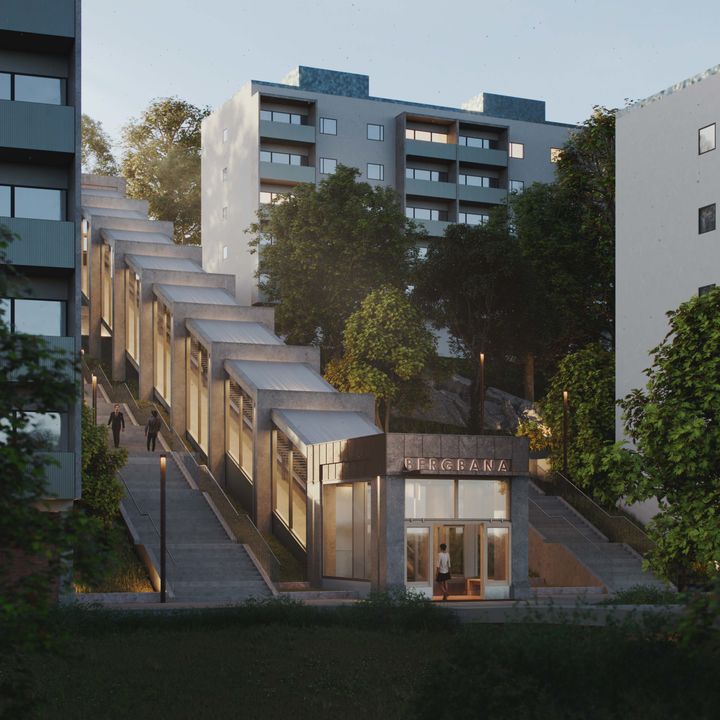 Inglasad upplyst bergbana mellan två hus