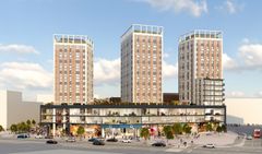 Ett modernt kvarter med bostäder opch kommersiella lokaler, omgivet av torg, gator och människor.