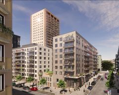 Tre moderna bostadshus i ett kvarter, med det högsta huset på 24 våningar som dominerar stadsbilden.