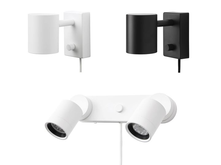 Vägglampor i modern design: en vit cylinderformad, en svart cylinderformad och en vit med två justerbara lamphuvuden.