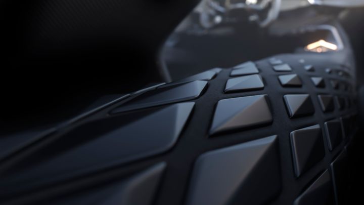 Närbild av en futuristisk bilinteriör med geometriska mönster på instrumentbrädan.