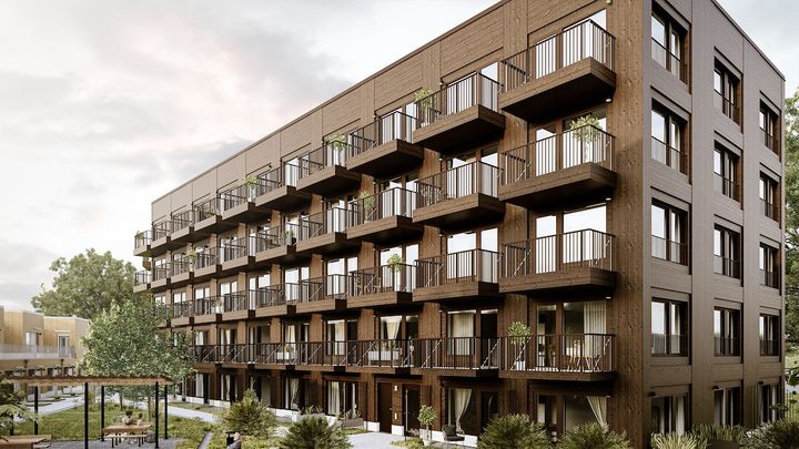 Bild på husets träfasad, med balkonger.