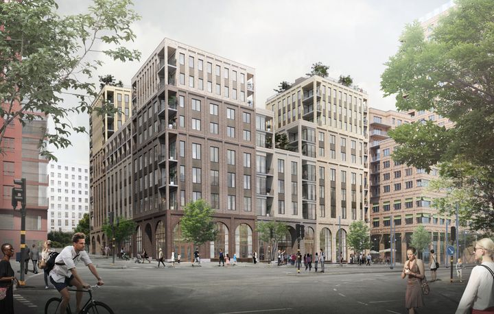 Visionsbild på vackra gråbruna tegelhus i Hagastaden