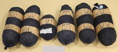 Fem stora och ett mindre paket fullproppade med heroin och kokain.