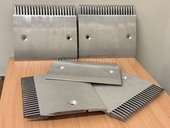 Fem av de 20 falska rulltrappsdelar som Tullverket stoppade i början av året.