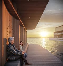 Det utkragande taket och den rytmiserande träytan skapar skyddade platser längs byggnadens sidor där människor kan sitta, vila och lyssna på musik som strömmar ut från högtalare som är omsorgsfullt integrerade i arkitekturen.