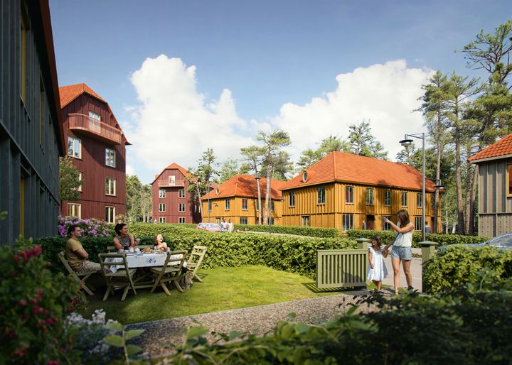 Radhusen på Trollskogsgatan i Stadsskogen får färgerna guldockra och varmbeige med kontrasterande snickerier. Fasaderna utförs i trä och bearbetas med en enkel men genomarbetad detaljering.