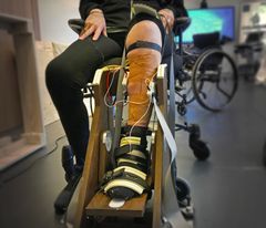 One of the study participants exerts force with their calf muscles while sensors measure electrical activity.