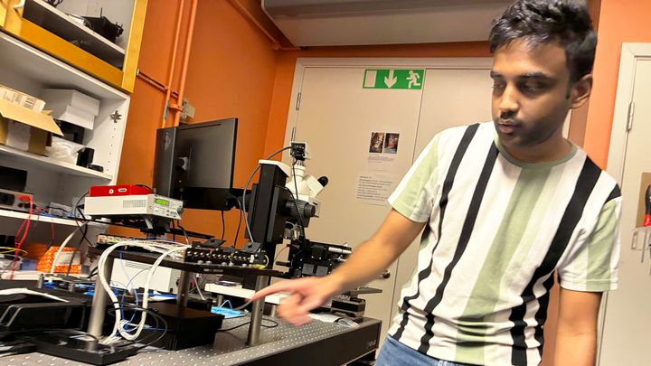 Govind Krishna shows the setup for the integrated photonic circuit that works "a bit like a programmable railway junction for quantum light".