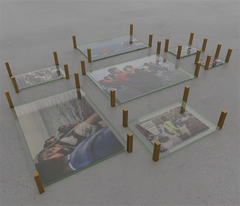 De utklippta tidningsbilderna kapslas in i glas och omgärdas av bronsstolpar. När sedan golvet läggs på syns endast ett mönster av bronskvadrater som visar var bilderna finns. Fotograf: Digital skiss: Nils Ekman.