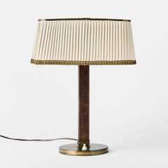 PAAVO TYNELL. Table lamp, Taito Oy, Finland, 1940s–50s, model 5066, brass, dark-stained beech, pleated silk shade.