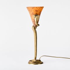 EDGAR BRANDT & DAUM. “Cobra,” table lamp, France, circa 1925, bronze with glass shade.