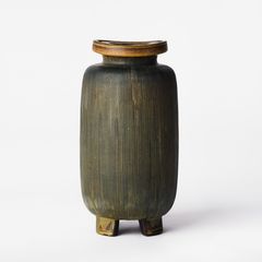 WILHELM KÅGE. Vase on four feet, Gustavsberg, 1952, flared rim, decorated with incised lines, brown and mustard-yellow glaze.