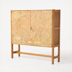 JOSEF FRANK. “Plan de Paris”, cabinet, Firma Svenskt Tenn, early 1950s, model B2144, walnut, the doors covered with a facsimile of Truschet and Hoyau’s 1550 map of Paris.