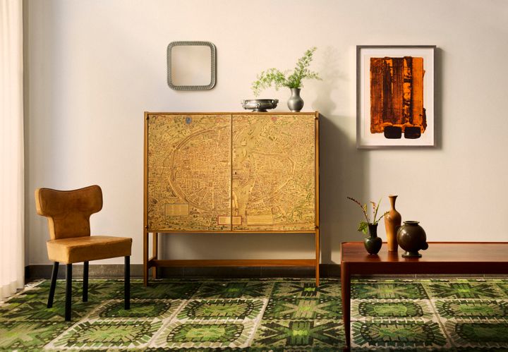 The exceptional Plan de Paris cabinet was made in walnut by Josef Frank and Firma Svenskt Tenn in the early 1950s. Its doors feature a facsimile of the rare 1550 map of Paris by Truschet and Hoyau, depicting the winding streets and landmarks of the Renaissance city.