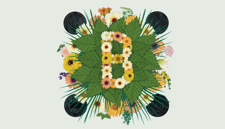 Blommor och blad arrangerade i form av bokstaven "B".