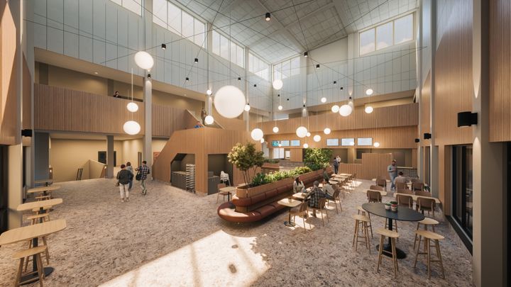 Alt%20text%3A%20Ett%20modernt%20atrium%20med%20ett%20caf%E9%2C%20reception%20och%20gott%20om%20naturligt%20ljus.