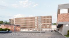 Vy över Gymnasietorget med ett modernt parkeringshus sett rakt framifrån.