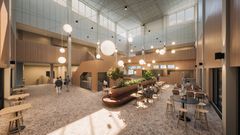 Alt text: Ett modernt atrium med ett café, reception och gott om naturligt ljus.